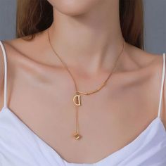 Material Gold Plated Modern Gold Plated Necklaces, Modern Gold-plated Necklaces, Elegant Plated Charm Necklaces, Elegant Gold-tone Plated Charm Necklace, Elegant Metal Charm Necklace With Lariat Shape, Elegant Metal Charm Necklace Lariat, Elegant Metal Lariat Charm Necklace, Modern Gold Necklaces For Anniversary, Elegant Tarnish Resistant Initial Pendant Chain Necklace