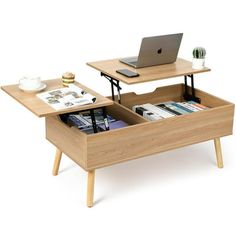 a coffee table with an open drawer underneath it and a laptop computer on the top