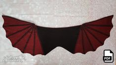 a red and black bat hanging on the wall