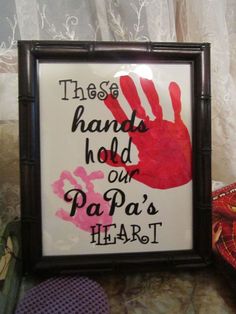 there is a sign that says these hands hold our papa's heart