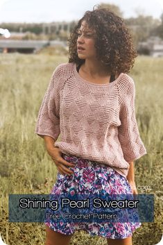 a woman standing in a field with her hands on her hips and the words shining pearl sweater