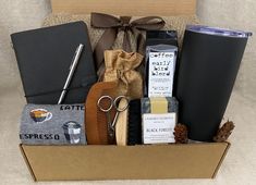 a box filled with personal care items on top of a couch next to a cup