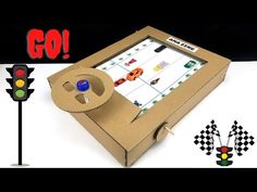 a cardboard box with a game in it and an image of a traffic light next to it