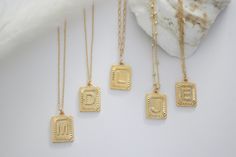 "Beautiful Initial gold square necklace perfect for any woman and is made with gold plated 14k. Simple enough for everyday wear and looks great stacked and layered. Also makes great gifts for bridal parties, birthdays, graduation or any special event! D E T A I L S: * Gold Plated 14K Chain * Letters Pendant: 24mm * 16mm aprox M A T E R I A L S: * Gold Plated 14K SIZE - Length = the open necklace laid straight & measured end to end without the extension. - This necklace comes in 16\" and we c Personalized Initial Necklace With Square Pendant, Minimalist Rectangular Initial Necklace For Everyday Wear, Minimalist Rectangular Initial Necklace For Everyday, Dainty Everyday Rectangular Initial Necklace, Dainty Gold Rectangular Initial Necklace, Personalized Rectangular Initial Necklace, Gold Rectangular Initial Necklace For Personalized Gift, Gold Rectangular Initial Necklace, Minimalist Gold Initial Necklace With Rectangular Shape