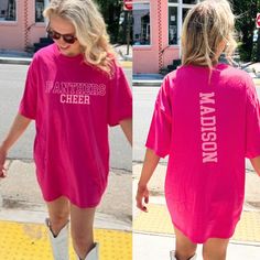 Need a custom cheer shirt? We got you covered. :)  These shirts are fully customizable! You can add any number and last name!  * PRODUCT DETAILS * ✺ 100% Cotton ✺ Wash and dry normally (on cool for best results) ✺ Designed and printed in the USA ✺ Due to different monitor screens, colors may vary ✺ * SIZING * ✺ FOR AN OVERSIZED FIT, SELECT TWO OR THREE SIZES UP FROM YOUR NORMAL SIZE ✺ ✺ Sizing is unisex ✺ Size guide: Please consult size chart in images * SHIPPING TIMES * ✺ Our items are individu Customizable Pink Tops For Game Day, Varsity Sublimation Short Sleeve Fan Gear, Pink Varsity Tops For Game Day, Pink Team Spirit Tops For Fan Gear, Pink Tops Team Spirit Fan Gear, Pink Tops With Team Name For Fan Gear, Customizable Casual T-shirt For Cheerleading, Pink Tops For Fan Gear With Team Spirit, Customizable Sporty Pink Tops