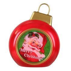 a red christmas ornament with a santa clause on it's face and the words merry christmas