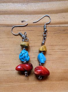 Turquoise, red, stone, and yellow jasper earrings. There may be minor variances in each pair (colors, shapes, sizes of beads and findings) Hypoallergenic finding materials. Comes with rubber earring backs. Nickel-free Red Southwestern Earrings, Red Southwestern Dangle Earrings, Nickel-free Southwestern Red Earrings, Adjustable Multicolor Earrings With Natural Stones, Southwestern Red Dangle Earrings, Southwestern Style Red Dangle Earrings, Southwestern Red Drop Earrings, Southwestern Style Red Nickel-free Earrings, Bohemian Red Earrings With Natural Stones