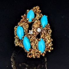 "An incredible Brutalist ring from the 1970s featuring turquoise and diamonds in 14k yellow gold Gold: tested 14k gold Markings: unmarked, acid tested 14k Gemstones: turquoise - five marquise cabochon cut turquoise 8x4mm, diamonds - total diamond weight 0.07ct by formula, round brilliant cut estimated color G-I / clarity I Gemstones measured and graded while set subject to mounting limitations, weight calculated by formula.  Color gemstones were not tested for enhancement treatments Ring Dimensions: ring top approximately 1 3/8\" wide (N-S), base of the shank 3.6mm Ring Size: 8.25 Total Weight:13.6 grams Condition:  item in very good estate condition, ring was re-sized at a point in time Items included: a lovely new ring box SKU: JA4652 LAYAWAY AVAILABLE, PLEASE SEE OUR SHOP POLICIES FOR D Aquamarine Ring Vintage, Antique Rings Victorian, Cocktail Vintage, Gold Tiger Eye, Sapphire Solitaire, Gold Cocktail Ring, Gold Cocktail, Victorian Rings, Diamond Cocktail Rings