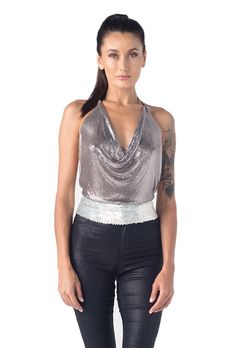 Metal halter top. Special shinny disco ball kind of metal material protected by fabric at the edges. Kayo original lotus flower metal piece at the neck for embellishment. Adjustable chain at the neck and back. Limited edition All one size Glamorous Shiny Tank Top For Party, Metallic Stretch Tank Top For Party, Metallic Fitted Tank Top For Party, Disco Style Tank Top For Party Season, Metallic Disco Tank Top For Night Out, Evening Party Season Halter Neck Tank Top, Glamorous Summer Halter Top For Festival, Fitted Shimmer Tank Top For Party, Glamorous Summer Festival Halter Top