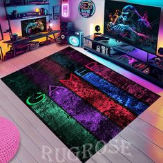 a living room filled with furniture and colorful rugs on the floor next to a flat screen tv