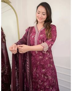 Grab this beautiful 3-piece set. The set comes with printed & embroidered kurta has v neck; 3/4th sleeves & calf length teamed with matching trouser pant and a chanderi cotton dupatta. The entire set has beautiful lace detailing. Color - Burgundy Kurta Fabric-Viscose Pant Fabric-Viscose Dupatta Fabric - Chanderi Cotton Neck-V Neck Sleeves-3/4th Sleeves Work - Print & Embroidery Detailing Washing Instructions-Dry Clean Model Height - 5.5 wearing size small. DISCLAIMER - The color of the product may be differ due to screen settings of device. A misprint here and a color drop slip there is the beauty of printing which is not treated as a defect. Formal Jewelry, Print Embroidery, Embroidery Detailing, Cotton Dupatta, Churidar, Suit Set, Fabric Shop, Embroidery Details, Formal Wedding