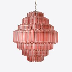 a pink chandelier hanging from a chain