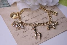 Vintage Noah's Ark bracelet, Gold tone link charm bracelet, Religious bracelet Dimensions: 16 cm (6.29 inches) Material - metal No maker's mark  Condition - This item is vintage, not new and may show some signs of wear or use. Please ask questions if you have any doubt of an items condition. ! Please make sure to review an item listing description carefully, examine photos, and read my 'Shipping Policies' before making your purchase. * Box not included Vintage Charm Metal Chain Bracelet As Gift, Vintage Charm Metal Chain Bracelet Gift, Vintage Metal Charm Bracelet With Chain, Adjustable Gold Charm Bracelet With Vintage Charm, Vintage Metal Chain Charm Bracelet, Adjustable Gold Vintage Charm Bracelet, Metal Chain Bracelet With Charms For Gift, Nickel-free Gold Metal Charm Bracelet, Metal Chain Bracelet With Charms As Gift