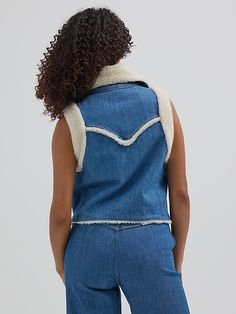 Warm up your look in the season to come with our newest sherpa vest for women. Combining denim and sherpa for a two-toned look with tons of texture, this versatile layer is a statement piece all its own. It features a regular fit that’s not too tight or too loose, with a cropped fit that shows off your shape. This vest comes with a full sherpa lining, collar, and shoulders as well as a full button closure for easy layering and two slash pockets. Wrangler Women, Jean Shirt Dress, Womens Sherpa, Sherpa Vest, Vest For Women, Boot Jewelry, Work Boots Men, Women's Jackets, Jean Shirts