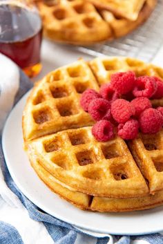 two waffles with raspberries on top