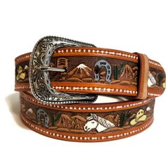 Treat yourself to a gift you truly deserve! Adorn yourself with the Western Horseshoe Leather Belt for Him and showcase your sophisticated taste in fashion and accessories, all while exuding that timeless rodeo charm. *MADE FROM EXCELLENT QUALITY LEATHER, it comes with pristine genuine leather that is hand-crafted and tested through time. *WITH AN EMBOSSED  HORSE AND HATS DESIGN, it shows your true love for the western style giving you that laidback cowboy look. *INCLUDES AN EASY SNAP BACK STRAP Western Leather Belt, Belt Jeans, Handmade Belt, Handmade Leather Belt, Cowboy Belt, Jeans Belt, Belt For Men, Handmade Belts, Leather Jeans