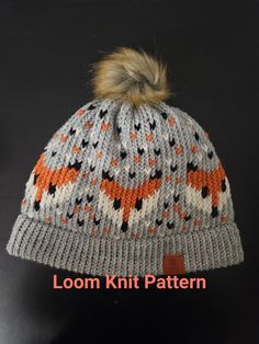 a knitted hat with an orange fox on it