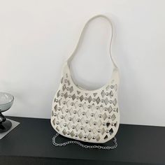 Place Of Origin : HE BEI  Province Types of bags : Shoulder Handbags Place Of Origin : HE BEI Province Occasion : Versatile Exterior : none Hardness : SOFT Closure Type : hasp Pattern Type : Solid Gender : WOMEN Style : fashion Decoration : hollow out,CHAINS,rivet Number of Handles/Straps : Single Lining Material : POLYESTER Handbags Type : Shoulder Bags Main Material : PU Shape : Hobos Brand Name : Brilliant Fish CN : Hebei WHAT ABOUT REFUND?   Fast refund,100% Money Back Guarantee. If your product is defective or doesnt work properly, let us know and well send you a replacement one. We believe in our products so much that we offer a 30-day No-Hassle refund policy. If youre unhappy about your purchase, send us the product back and well refund your money immediately. Handheld Shoulder Bag With Chain Strap For Shopping, Casual Summer Shoulder Bag With Chain Strap, Spring Casual Party Shoulder Bag, Casual Spring Party Shoulder Bag, Trendy Party Hobo Bag, Trendy Shoulder Bag With Chain For Shopping, Trendy Satchel Hobo Bag, Trendy Shoulder Bag With Chain Strap For Spring, Casual Shoulder Bag With Chain For Everyday Use