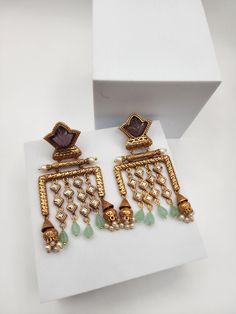 Length around 4 inches Traditional Jeweled Dangle Danglers, Festive Jeweled Chandbali Earrings, Elegant Heavy Jhumkas For Designer Wear, Festive Metal Jeweled Earrings, Festive Jeweled Danglers, Fusion Kundan Jeweled Earrings, Fusion Style Kundan Jeweled Earrings, Traditional Jeweled Drop Earrings Danglers, Festive Kundan Jeweled Chandelier Earrings