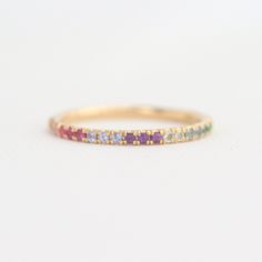 14K Yellow Gold Rainbow Ring, Rainbow Half Eternity Band, Multi-Color Ring, Pink Sapphire Tanzanite Amethyst Aquamarine Green Emerald Ring Thank you for stopping by Blush Karats. This listing is for a stunning half eternity rainbow band set in a pristine U prong micro-pave style. The band features a combination of light pink sapphires, bright pink sapphires, light lavender tanzanite, amethyst, light blue aquamarine, deep blue aquamarine, and vivid green emeralds. All gemstones are natural and fe 14k Gold Multi-stone Eternity Band, 14k Gold Multi-stone Eternity Band For Anniversary, Multi-stone 14k Gold Eternity Band For Anniversary, Cubic Zirconia Eternity Band With Gemstones, Gemstone Eternity Band With Cubic Zirconia, Yellow Gold Multi-stone Eternity Band In Cubic Zirconia, Yellow Gold Eternity Band With Birthstone, Multi-stone Stackable Wedding Rings, Multi-stone Stackable Round Band Rings For Wedding