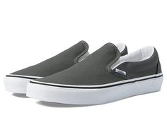 Vans Classic Slip-On Wide - Shoes : Charcoal : Improve speed and comfort of your feet by wearing Vans Classic Slip-On Wide footwear. Textile upper. Textile lining and insole. Slip-on style. Round toe. Elastic side gores. Low-top design. Branding at heel. Synthetic outsole. Imported. Measurements: Weight: 13 oz Product measurements were taken using size Men's 9, Women's 10.5, width Wide. Please note that measurements may vary by size. Weight of footwear is based on a single item, not a pair. Vans Slip-on Sneakers, Sporty Vans Slip-ons With Rubber Sole, Comfortable Vans Slip-on Sneakers, Sporty Vans Slip-ons, Vans Casual Slip-ons With Rubber Sole, Casual Vans Slip-ons With Rubber Sole, Casual Vans Slip-ons With Round Toe, Vans Cushioned Slip-on Sneakers, Vans Slip-on Sneakers With Cushioned Footbed