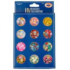 an assortment of different colored buttons in a package