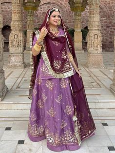 Upada Silk Partywear Dabka Kundan Work Rajputi Poshak In Purple Colour-82026 Product Details: Fabric: High-quality important (Natural) Crape Sout Work: Exquisite Aree Touch  Resham Dabka Kundan Full hand work odni men Four Side boder Odna me n Beutiful Work Hand Gota Kiran Complete: Enhancing the beauty of the outfit Odhna Fabric: Hamrahi pyor  Color: Purple  Occasion:Mehendi Sangeet, wedding Party Wear Washing Instruction:Dry Wash Color : Same as pr photo ( 5 to 7 % color version may be ) The Semi-stitched Lehenga Waist and Hips are Customizable from 28 to 44 inches and from 32 to 44 inches respectively and Lehenga Length is 42 inches Do note: Accessories shown in the image are for presentation purposes only.(Slight variation in actual color vs. image is possible.) Beautiful crafted Rajpu Rajasthan Outfit Ideas, Rajputi Dress Poshak, Rajasthani Poshak, Rajasthani Bride, Rajasthani Dress, Vs Image, Rajputi Dress, Kundan Work, Stitched Lehenga