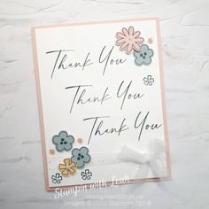 a thank you card with flowers on it