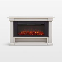 an electric fireplace with red flames in the center and white mantles on either side