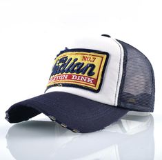 Men's vintage trucker cap: the iconic accessory for a casual and trendy look

 The vintage trucker cap for men is an iconic fashion accessory that is perfect for those looking for an authentic vintage look. With its unique design and distinctive shape, this cap offers protection from the sun, rain and wind during outdoor activities. It is characterized by its foam front crown, curved visor and mesh at the back that provides good ventilation for optimal comfort . The vintage trucker cap for men is decorated with classic logos and patterns for an authentic vintage look. It is perfect for casual outfits for an authentic and relaxed style. It is also ideal for festive events, such as music festivals or outdoor parties. Discover our collection of vintage trucker caps for men and find the one th Bone Bordado, Sweat Vintage, Trendy Caps, Mens 90s, Trendy Fashion Accessories, Embroidery Baseball, Stylish Caps, Green Cap, Mens Trendy Outfits