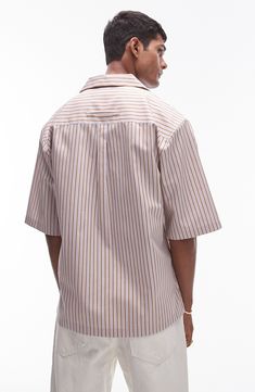 A vintage-inspired camp shirt is great for warm weather with its vertical stripes and oversized fit that looks current for today. 29" length; 46" chest (size Medium) Front button closure Notched collar Elbow-length sleeves Chest patch pocket 100% cotton Machine wash, tumble line Imported Striped Cotton Camp Shirt With Camp Collar, Casual Shirt With Striped Spread Collar, Casual Shirt With Contrast Stripes For Spring, Casual Contrast Stripes Shirt For Spring, Casual Spring Shirt With Contrast Stripes, Spring Horizontal Stripe Collared Shirt, Casual Pinstripe Shirt With Spread Collar, Relaxed Fit Horizontal Stripe Shirt For Spring, Relaxed Fit Shirt With Horizontal Stripes For Spring