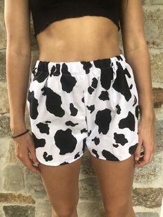 Cow Print Shorts. Great to wear for your next festival. Super cute summer shorts. Super cute and really comfy shorts with a high cut. Made from a 100% cotton fabric with an elastic waist band. Great gift for a birthday, holiday or even a treat for yourself. All of my shorts are made to order so if you have a special request you can leave me a note with your order telling me your exact size specifications. If you don't see your size, if you need the shorts bigger or smaller just tell me and I can Fun Vacation Bottoms With Built-in Shorts, Trendy Summer Shorts With Elastic Waistband, Beachwear Bottoms With Built-in Shorts For Festival, Trendy Bermuda Shorts For Summer, Cotton Athletic Shorts For Beach, Cotton Athletic Shorts For The Beach, Trendy Summer Pajama Shorts, Trendy Pajama Shorts For Summer, Fun Bottoms With Built-in Shorts For Beach Season