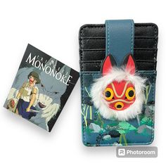 a phone case with an image of a cat on it and a book in the background