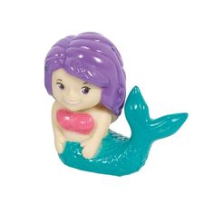 a plastic toy mermaid sitting on top of a blue and purple object