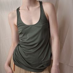 Dior FW 2005 Army Green Tank 120.00 Icarus Vintage Green Racerback Vest Top, Casual Green Racerback Vest, Green Everyday Tank Top, Everyday Green Tank Top, Green Everyday Tank Top With Tank Straps, Sporty Tops With Pockets For Summer, Casual Olive Sleeveless Top, Casual Sleeveless Olive Tops, Sporty Green Tank Top