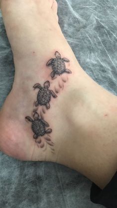 a small turtle tattoo on the ankle