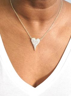 Do you want to feel the sparkle and joy of love? Look no further than the Amara Heart Diamond necklace – your new favorite piece of jewelry! This brilliant necklace features a heart-shaped cubic zirconia with a gorgeous shiny finish. The diamond-like beauty of this necklace is sure to make heads turn! Plus, its rhodium-plated or gold-plated 16" plain chain with a 2" extender provides flexibility should you want to layer it with other necklaces. Experience its beautiful sparkles for yourself and Diamond Heart Pendant Jewelry For Party, Heart Pendant Diamond Jewelry For Party, Heart-shaped White Gold Necklace With Sparkling Stones, Diamond Heart Pendant For Party, Elegant Cubic Zirconia Heart Necklace For Party, Heart Pendant Bling Jewelry For Party, Party Jewelry Heart Pendant With Bling, White Heart Pendant Necklace For Party, Heart Pendant Party Jewelry With Bling