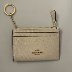 Never Used White Coach Wallet White Coach Wallet, Everyday Beige Bag With Coin Pocket, Beige Coin Purse With Interior Card Slots, Beige Coin Purse With Interior Card Slots For Everyday, Beige Everyday Coin Purse, Classic Coach Coin Purse For Everyday Use, Beige Pouch Wallet With Interior Card Slots, Elegant White Coin Purse With Interior Card Slots, Elegant Card Holder With Zipper Closure For Everyday Use