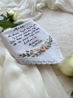 Hand-Embroidered Wedding Handkerchief with Floral Design.  Celebrate your special day with our beautifully crafted handkerchief, made from a luxurious linen-cotton blend. This unique piece is not only functional but also a sentimental keepsake for the bride and her beloved mother.  Fabric: Crafted from soft, durable linen-cotton fabric, this handkerchief offers a perfect balance of elegance and comfort, ideal for wiping away tears of joy. Words:  Handkerchief is embroidered with the touching wor Elegant Machine Embroidered Handkerchiefs For Gifts, Traditional Handmade Handkerchiefs As Gifts, Handmade White Handkerchiefs For Gift, Elegant Embroidered Handkerchiefs Gift, White Handmade Handkerchief As Gift, Wedding Handkerchiefs With Machine Embroidery, Handmade White Wedding Handkerchiefs, Elegant Embroidered Handkerchiefs For Wedding Gift, White Wedding Handkerchiefs With Custom Embroidery