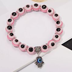 Elastic Rope Chain Bead Bracelet. Weight 13g Pink Evil Eye Palm Bracelet Pink Evil Eye Jewelry, Black Beads Stretch Bracelet As Gift, Pink Jewelry With Black Beads For Gift, Bohemian Silver Jewelry With Letter Beads, Party Jewelry Bracelet With Letter Beads, Silver Bohemian Jewelry With Letter Beads, Party Bracelet With Letter Beads, Party Letter Beads Bracelet Jewelry, Party Letter Beads Bracelet