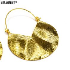 Let your fashion speak for itself with these gorgeous Fashion Retro Female Ornament Earrings Alloy Exaggerated by Maramalive™! These light-weight earrings are crafted from metal alloy and feature an exaggerated shape with a minimalist design, making them the perfect statement piece to complete any outfit. You will love the crystal accents that dance in the light and lend to the elegant beauty of these stunning earrings.These shimmering earrings make the perfect gift for the special woman in your Nickel-free Gold Alloy Hoop Earrings, Handmade Alloy Earrings For Party, Handmade Gold Alloy Earrings, Single Hoop Earring In Alloy For Parties, Nickel-free Gold-plated Hoop Earrings For Party, Brass Pierced Hoop Earrings For Party, Brass Plug Earrings For Party, Party Brass Hoop Earrings With Ear Wire, Nickel-free Brass Hoop Earrings For Party