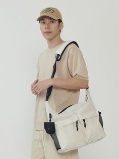 Editor's notesIt is a casual and trendy messenger bag. The bag is spacious and has two zip pockets on the front.- Messenger bag- Two zip pockets- Spacious- Mesh pocketsMeasurements(in.)One Size- Width: 14 in.- Height: 11.4 in.- Depth: 3.9 in.*Model info: Height 5’ 11” Waist 32 in. / Fitting size: One SizeComposition & Care- 100% Polyester- Hand wash in cold waterDesigner- by ANALOGMOOD Messenger Bag, Zip Pockets, The 100, Hand Wash, Mesh