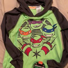 Ninja Turtle Long Sleeve Shirt Boys Size 8 Nwt Sporty Long Sleeve Tops With Character Print, Sporty Multicolor Character Print Tops, Sporty Multicolor Tops With Character Print, Playful Multicolor Sports Top, Sporty Long Sleeve Playwear Top, Playful Green Top For School, Playful Green Tops For School, Multicolor Long Sleeve Tops For Playwear, Sporty Long Sleeve Tops For Playwear