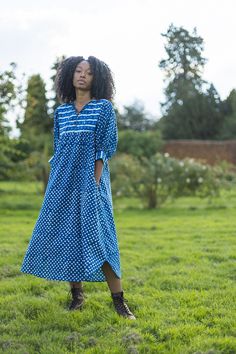 An elegant 100% organic cambric cotton summer dress.  Crafted from indigo dyed dabu block prints. Designed in England and printed in India. We pour a lot of love into our block printed dresses. Each one is made from super soft organic cotton and  fully traceable back to our lovely printers in Jaipur India. FEATURES Organic cotton Easy pull on over the head style. Scooped neckline with tie and coconut button down detail Mid arm lantern sleeves with contrast cuff and coconut buttons Mid calf length shirt tail hem In seam side pockets CARE Pre washed. Wash separate first wash. Handwash or wash cool. Do not tumble. Line dry. Hot iron. Made in a small batch. Once they are gone they're gone . Well crafted. Low environmental impact. Small batch production. Sizing Guide   UK SIZING  MODEL IS A UK Blue Dress Summer, Block Print Dress, Dress Vacation, Marine Uniform, Head Style, Vacation Dress, Printed Summer Dresses, Cotton Dress Summer, Indigo Dye