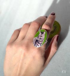 “Zebra” enamel ring. Shiny playful ring will bright up any day, fun to wear. Made of fine silver in cloisonné technique. Oval size 1 1/4 x 1 (3.5 cm x 2.5 cm ) Enamel care Shiny colors of enamel jewelry will never go pale. But as any other jewelry it needs gentle care. Please avoid Oval Green Enamel Ring Gift, Artistic Hand Painted Silver Rings, Green Enamel Rings As A Gift, Hand Painted Enamel Ring, Handmade White Enamel Ring, Unique Green Enamel Ring For Gift, Sterling Silver Enamel Ring Gift, Hand Painted Enamel Rings For Gifts, Silver Hand Painted Rings For Gifts