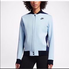 Here Is A Fun Nike Light Blue Varsity Style Tech Pack Jacket Size Small That Is New With Tags. It Has In Store Wear Like A Small Spot On Front And The Top Button Is Broken As Shown In Close Up Pictures. This Nwt Nike ‘Tech Pack’ Women’s Jacket Is Light Blue, Dark Blue, And Black. Features: Zipper, Snaps, Pockets, Placket Back With A Black Vertical Stripe Along The Length, Ribbed Cuffs, Hem, And Collar H-1 Nike Fleece, Tech Pack, Yoga Clothing, Nike Tech Fleece, Letterman Jacket, Nike Tech, Tech Fleece, Nike Store, Peak Performance