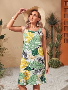 Expertly crafted with a scoop neck and tropical print, our Exotic Elegance dress is the epitome of chic and sophisticated style. Made with high-quality materials, it effortlessly showcases a tropical flair that will make you stand out in any setting. Embrace the benefits of effortless elegance with this stunning dress. Color : Multicolor Style : Boho Type : Tank Pattern Type : Tropical Sleeve Length : Sleeveless Neckline : Round Neck Waist Line : Natural Hem Shaped : Straight Length : Knee Length Fit Type : Regular Fit Fabric : Non-Stretch Material : Fabric Composition : 95% Polyester, 5% Elastane Care Instructions : Machine wash or professional dry clean Sheer : No Size US Bust Hip Size Length Shoulder Waist Size S 4 36.8 41.1 37.4 13.4 38.2 M 6 38.4 42.7 38.2 13.6 39.8 L 8/10 40.7 45.1 3 Tropical Sleeve, Tank Pattern, Elegance Dress, Scoop Neck Dress, Navy Blue Dresses, Waist Line, Comfy Hoodies, Smock Dress, Style Boho