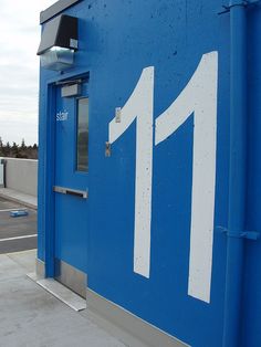 a blue building with the number 11 painted on it