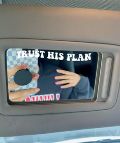 a woman's hand on the dashboard of a car that says, trust his plan