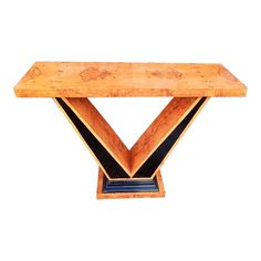 an art deco console table with black and gold trimmings on the edges,